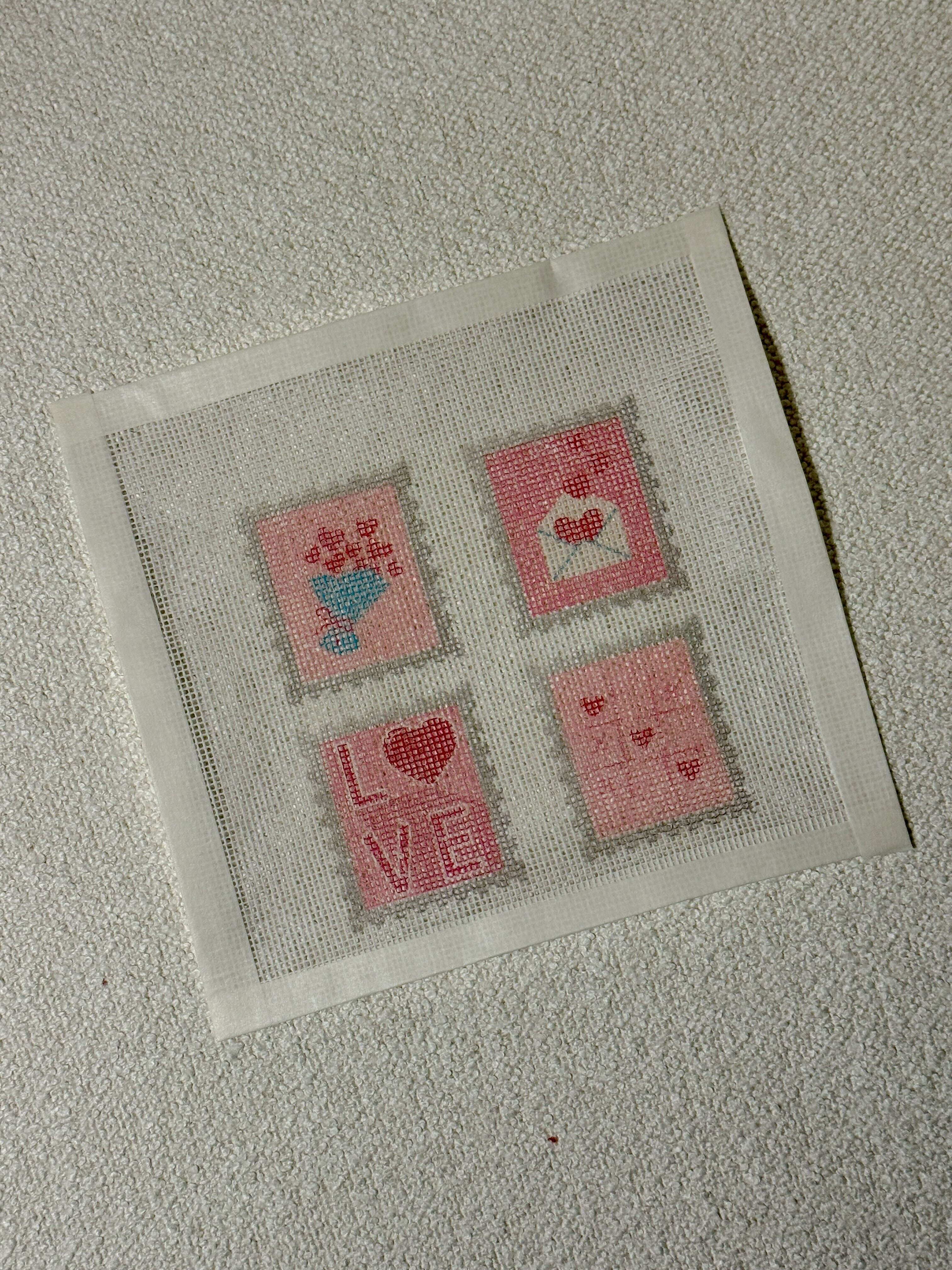 Needlepoint Design with Valentine's Day Stamps on a white background
